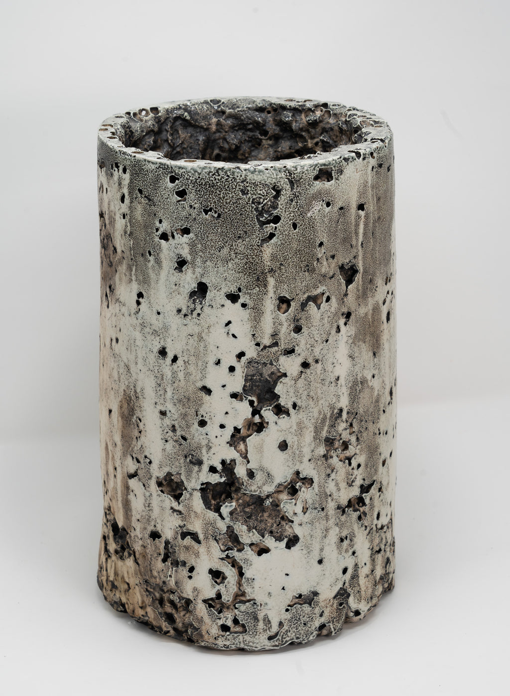 Cylindrical porcelain planter with textured surface on a white background